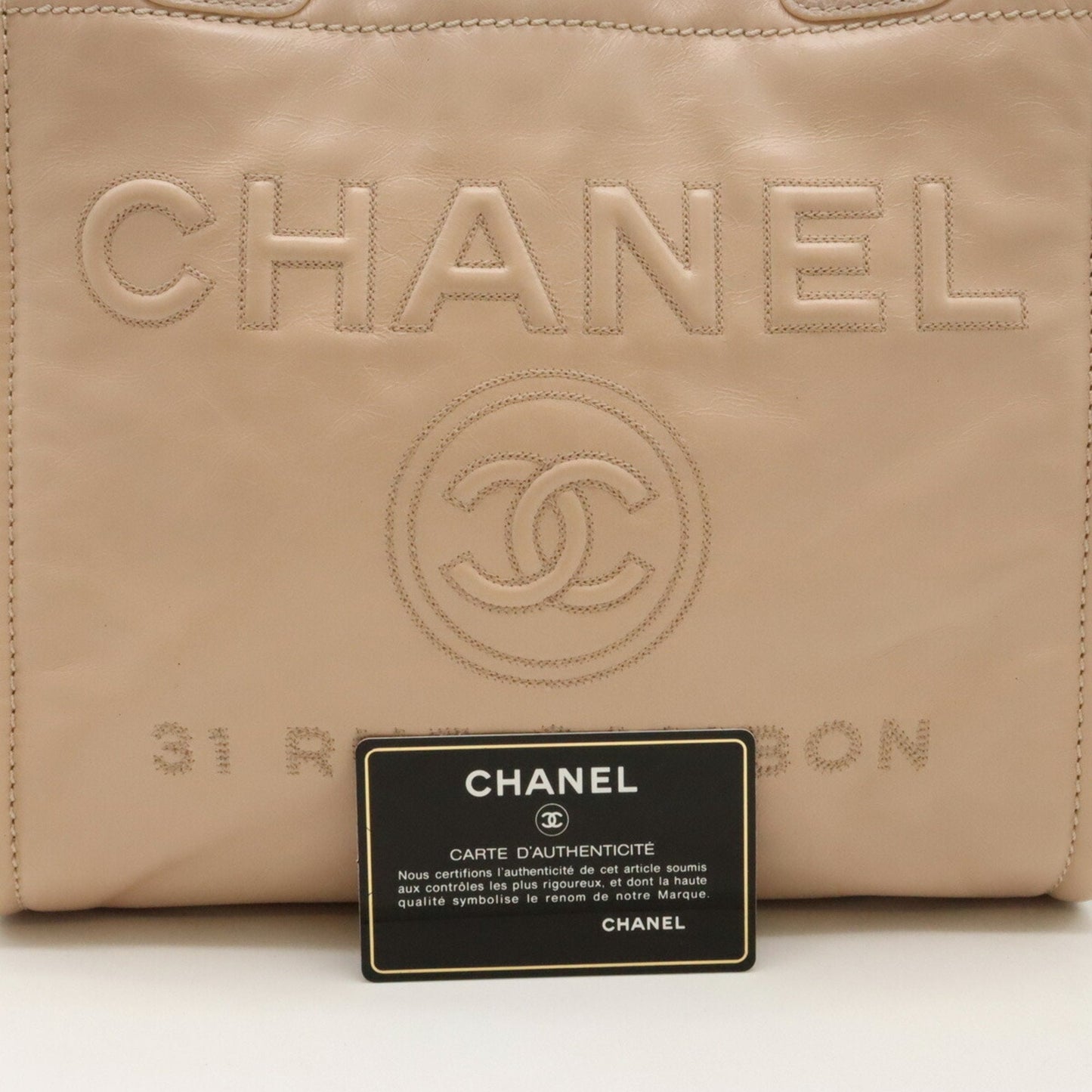 Chanel Sac Deauville en cuir beige