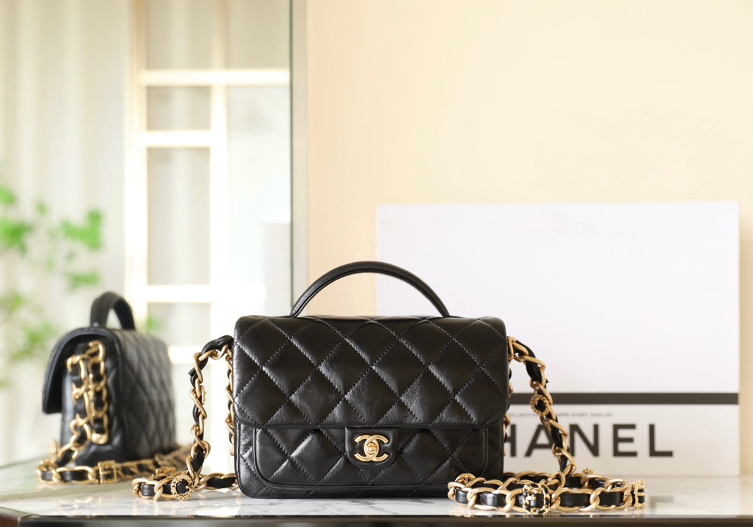 CHANEL 24a flap bag 20cm top handle black lambskin gold hardware