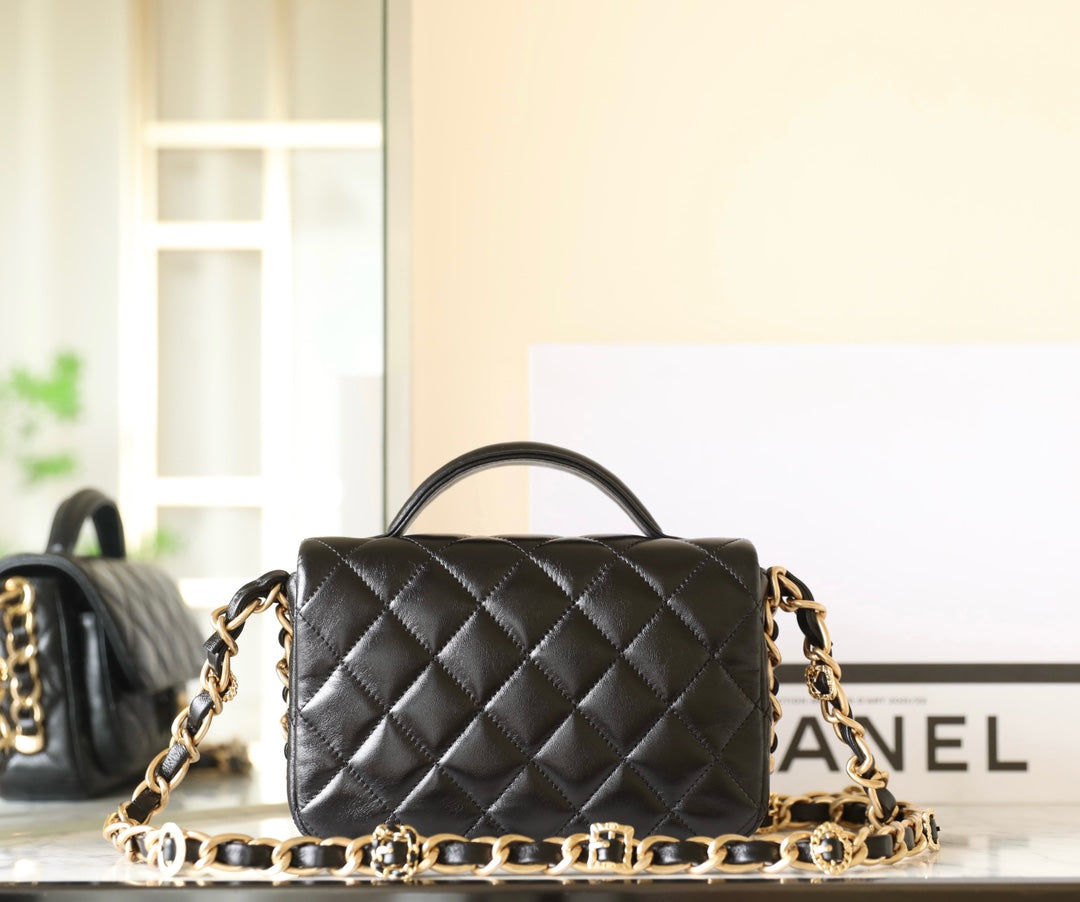 CHANEL 24a flap bag 20cm top handle black lambskin gold hardware