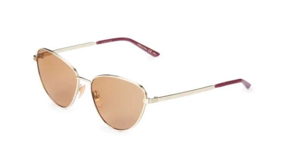 Gucci Cat Eye Sunglasses in Gold