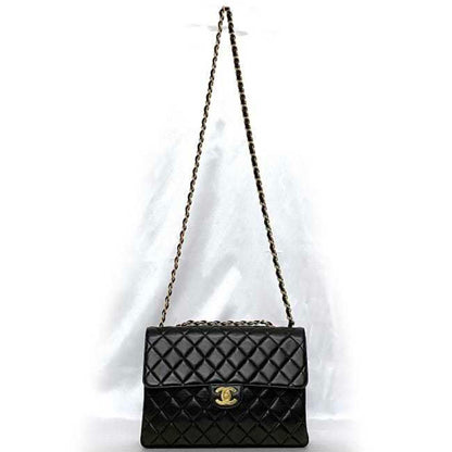 Chanel Sac Chain Flap en cuir noir