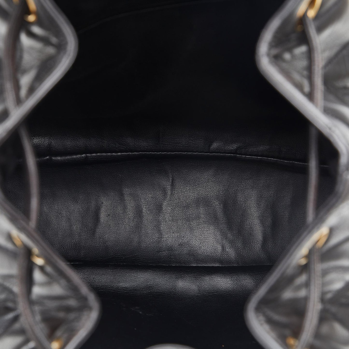 Chanel CC Quilted Lambskin Drawstring Backpack (SHG-86DOIB)
