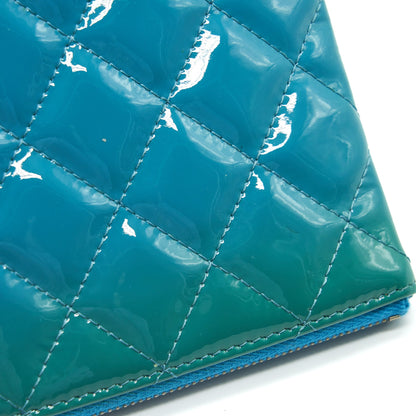 CHANEL QUILTED LEATHER CLUTCH BAG IN PATENT BLUE