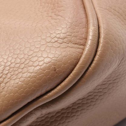Brown Chanel Caviar Button Handbag