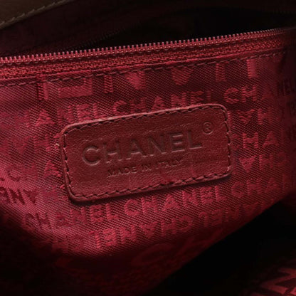 Brown Chanel Caviar Button Handbag